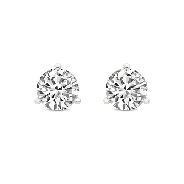 14K White Gold Pair Of Round Diamond Stud Earrings Set In Three Prongs Featuring 2 Round Diamonds At A Total Weight Of .77CT, H In Color And SI1 In Clarity