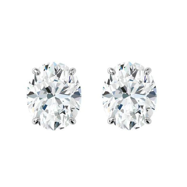 Pair of 14K White Gold Four Prong LAB GROWN Diamond Stud Earrings Featuring 2 Oval Diamonds At .66CT Total Weight - G/H Color SI Clarity